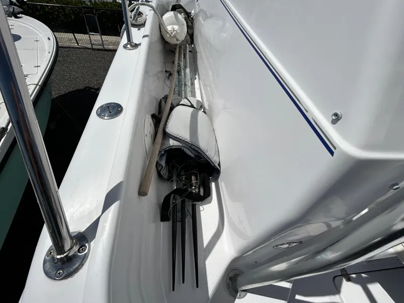 Slide: The Image of 1999 Pro-Line 2950 WALK boat deck with fishing gear and equipment. - 13