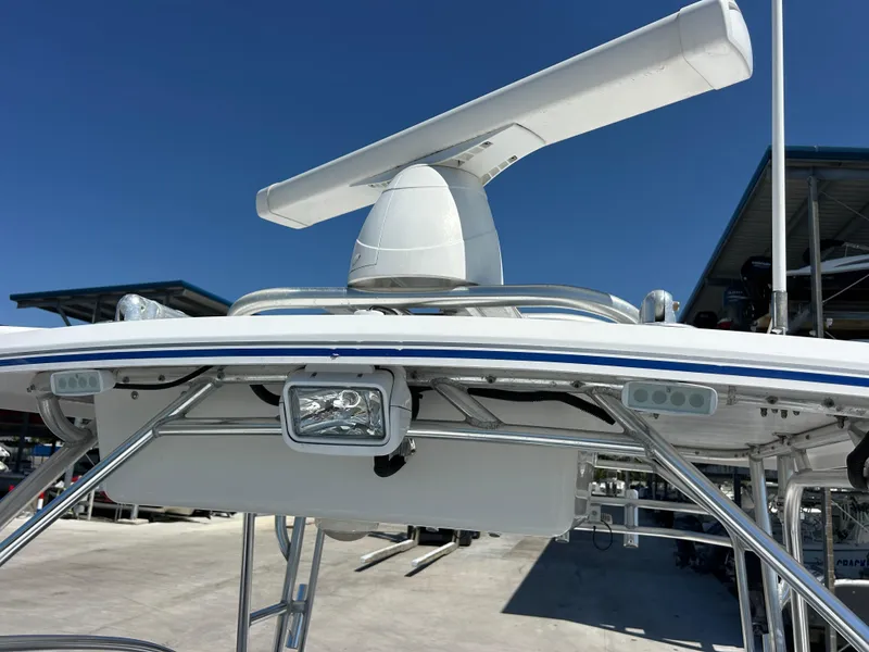Slide: The Image of 1999 Pro-Line 2950 WALK boat radar and lighting system under clear blue sky. - 14