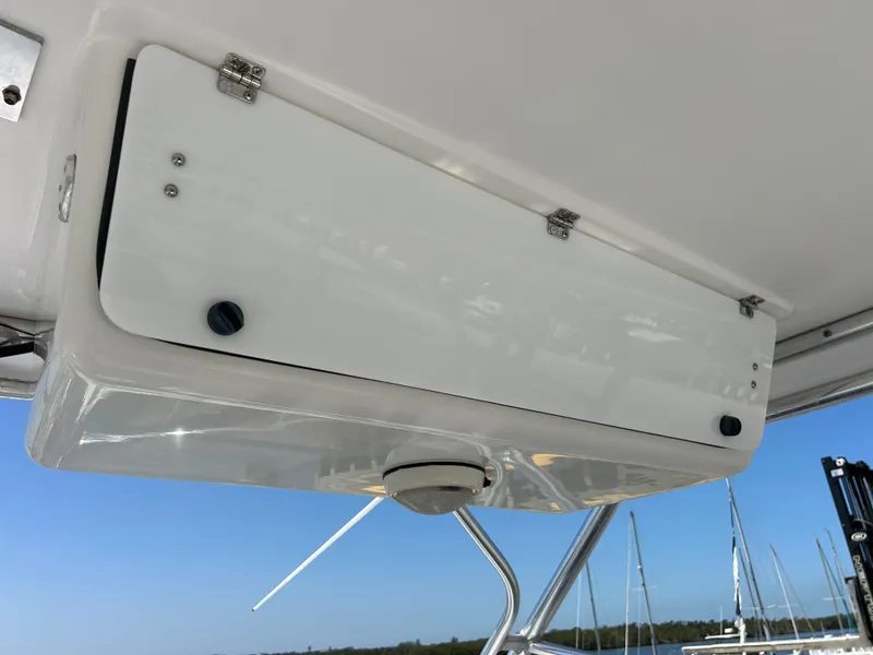 Slide: The Image of 1999 Pro-Line 2950 WALK boat storage compartment with blue sky background. - 16