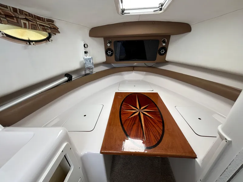 Slide: The Image of 1999 Pro-Line 2950 WALK cabin interior with wood table and modern design. - 24
