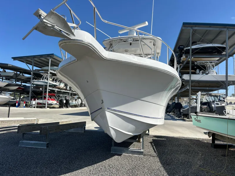 Slide: The Image of 1999 Pro-Line 2950 WALK boat in dry storage, viewed from the front. - 3