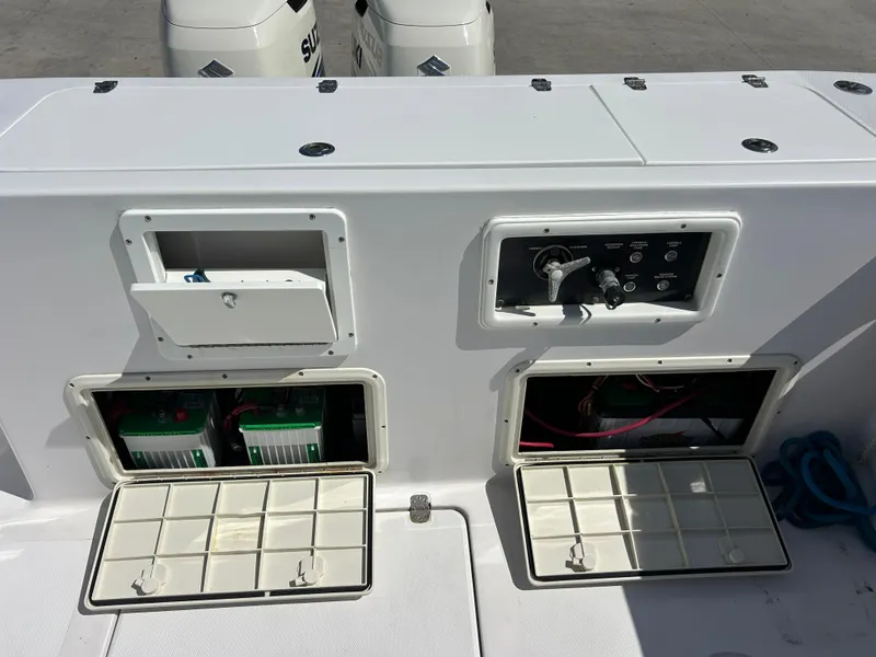 Slide: The Image of 1999 Pro-Line 2950 WALK boat dashboard with open compartments and control panel. - 44