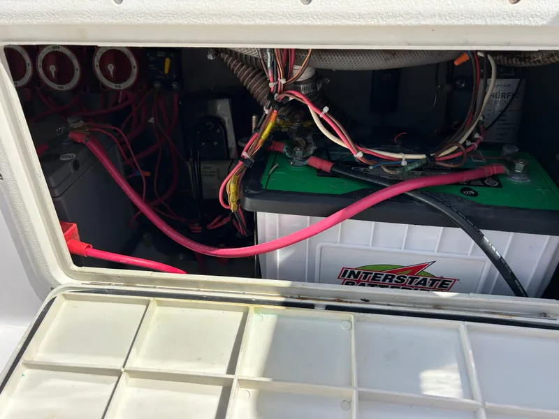 Slide: The Image of Battery compartment of 1999 Pro-Line 2950 WALK boat with Interstate battery and wiring. - 45
