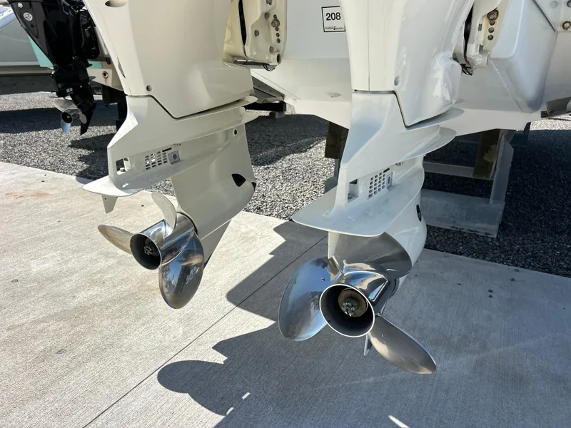 Slide: The Image of Twin propellers of a 1999 Pro-Line 2950 WALK boat on display. - 54