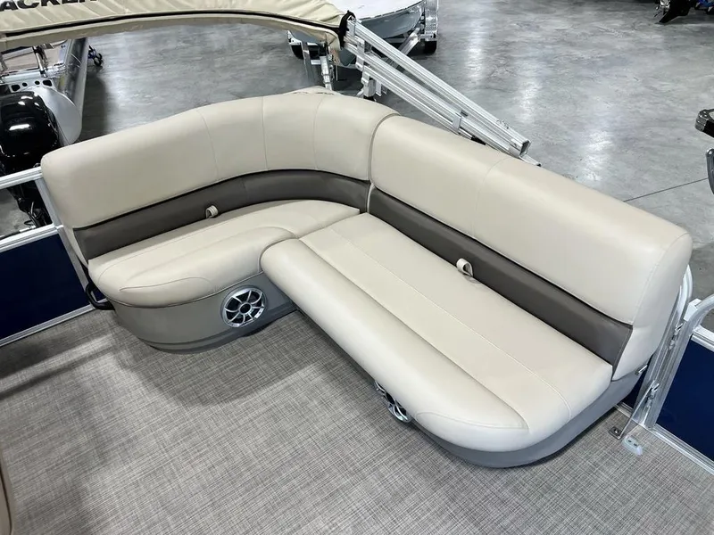 Slide: The Image of 2025 Sun Tracker Bass Buggy® 16 XL Select pontoon seating, beige and gray upholstery, spacious layout. - 11