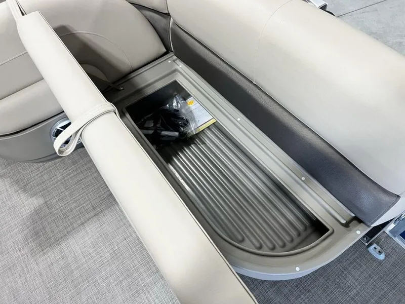 Slide: The Image of 2025 Sun Tracker Bass Buggy® 16 XL Select storage compartment with beige seating. - 13