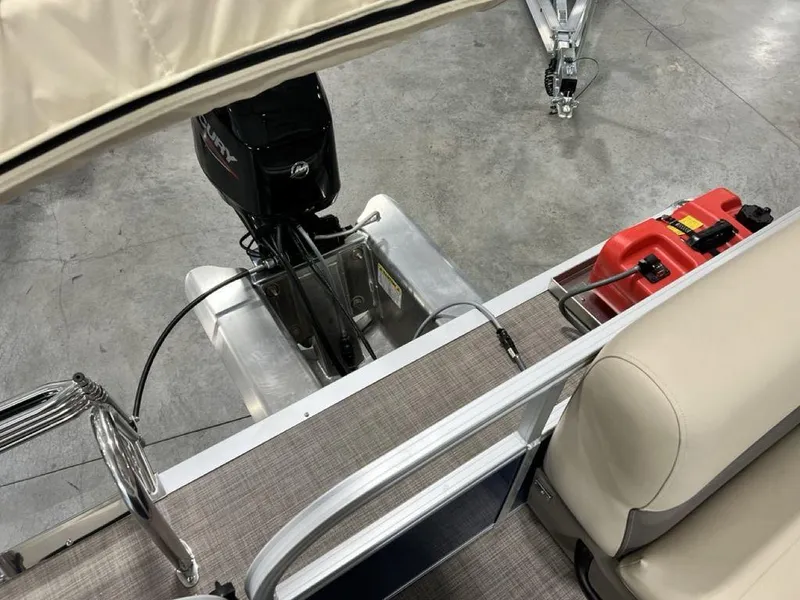 Slide: The Image of 2025 Sun Tracker Bass Buggy® 16 XL Select pontoon boat interior with motor and seating. - 15