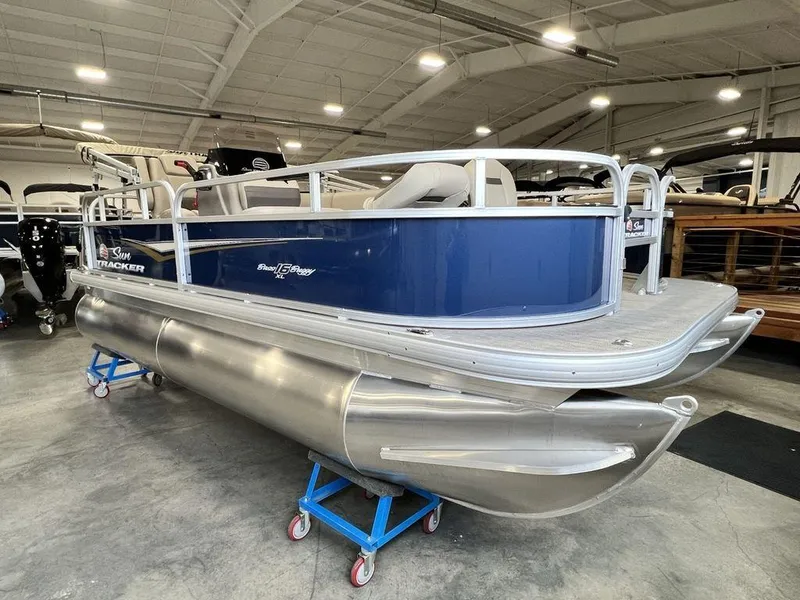 Slide: The Image of 2025 Sun Tracker Bass Buggy® 16 XL Select pontoon boat in showroom. - 3