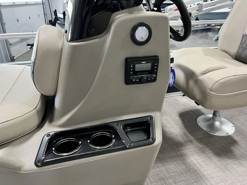 Slide: The Image of 2025 Sun Tracker Bass Buggy® 16 XL Select interior with cup holders and control panel. - 8