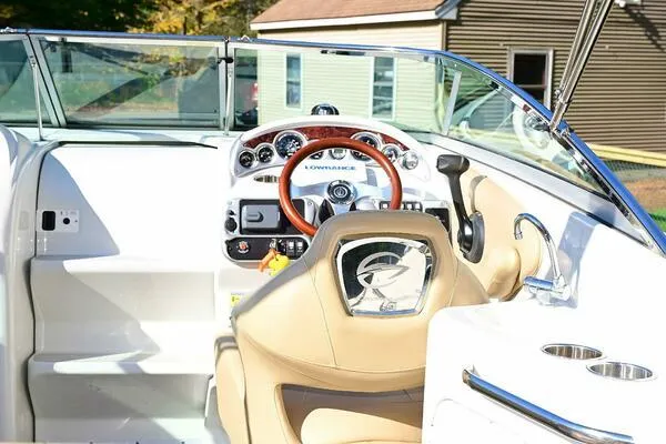 Slide: The Image of 2015 Crownline 236 SC boat interior with steering wheel and dashboard controls. - 17