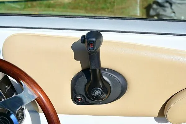 Slide: The Image of Throttle control of 2015 Crownline 236 SC boat, featuring a sleek design and ergonomic handle. - 33