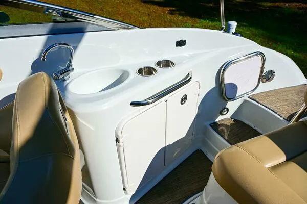 Slide: The Image of 2015 Crownline 236 SC boat interior with seating and storage compartments. - 41