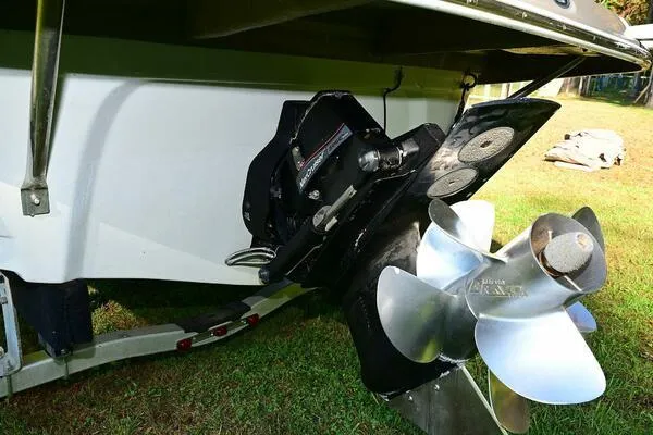 Slide: The Image of 2015 Crownline 236 SC boat propeller and stern drive on grass. - 48