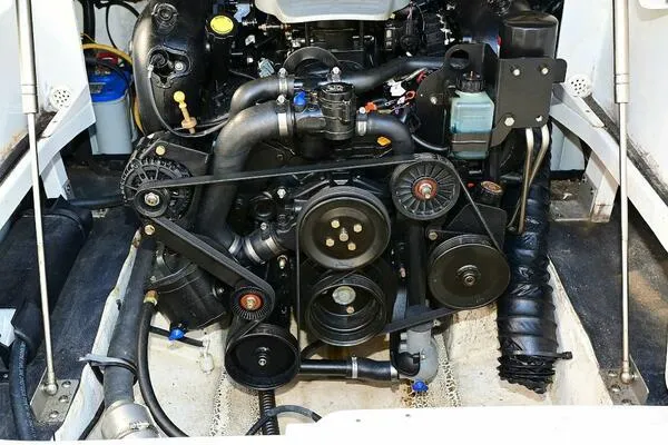 Slide: The Image of Engine of 2015 Crownline 236 SC boat, showcasing belts and components. - 24