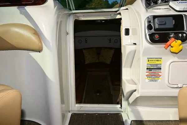 Slide: The Image of 2015 Crownline 236 SC boat interior with cabin entrance and control panel. - 31