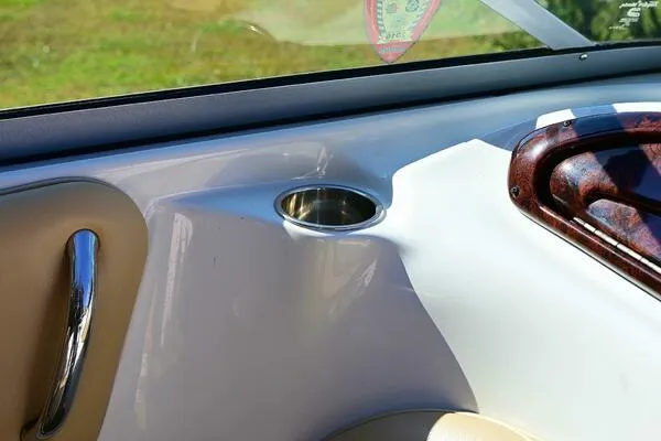 Slide: The Image of Interior of 2015 Crownline 236 SC boat featuring a cup holder and sleek design. - 40