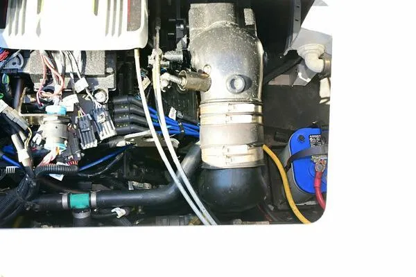 Slide: The Image of Engine compartment of a 2015 Crownline 236 SC boat, showing wiring and components. - 22