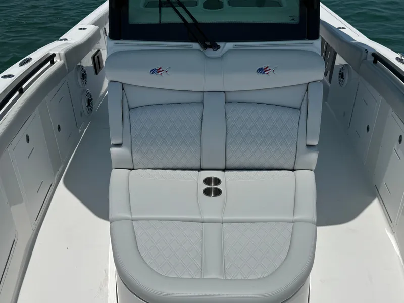 Slide: The Image of 2025 Crevalle 33 CSF boat interior with cushioned seating and cup holders. - 20