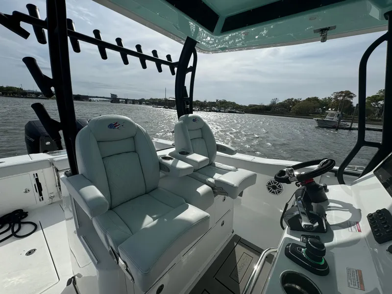 Slide: The Image of 2025 Crevalle 33 CSF boat interior with dual captain seats on a sunny day. - 27