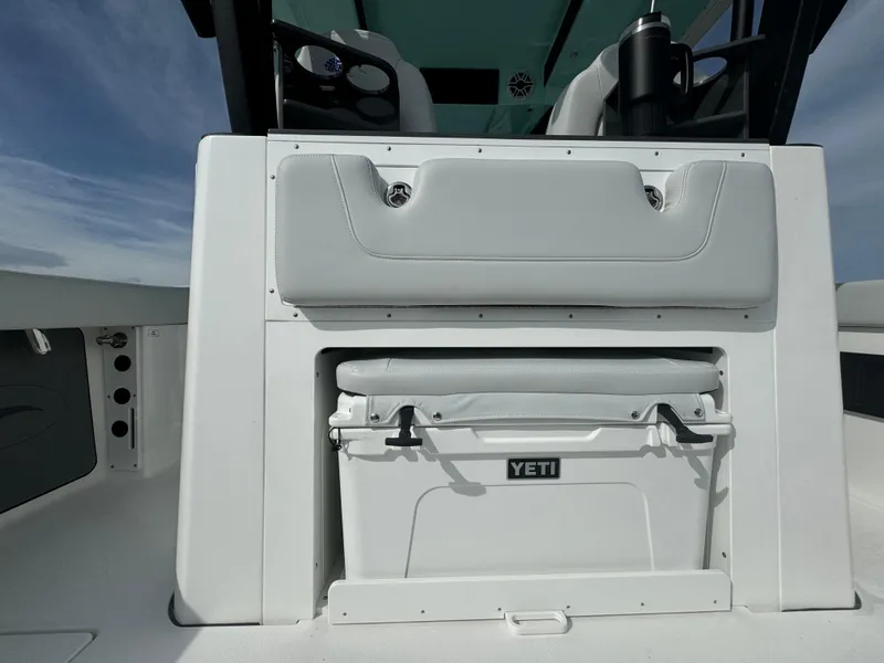 Slide: The Image of 2025 Crevalle 33 CSF boat with Yeti cooler storage under seat. - 32