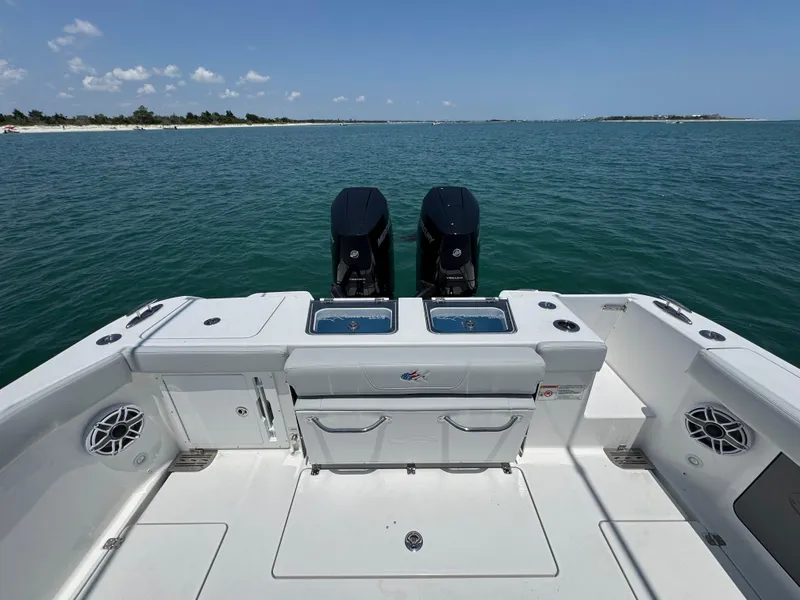 Slide: The Image of 2025 Crevalle 33 CSF boat with dual engines on open water. - 42