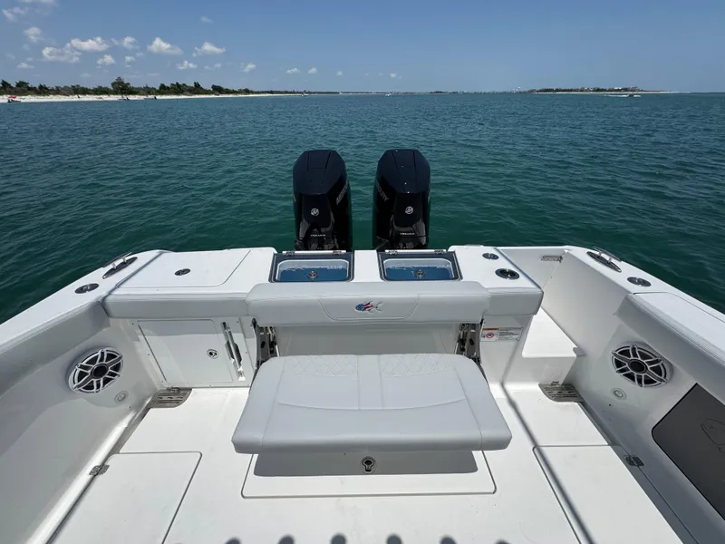 Slide: The Image of 2025 Crevalle 33 CSF boat with dual engines on open water. - 44