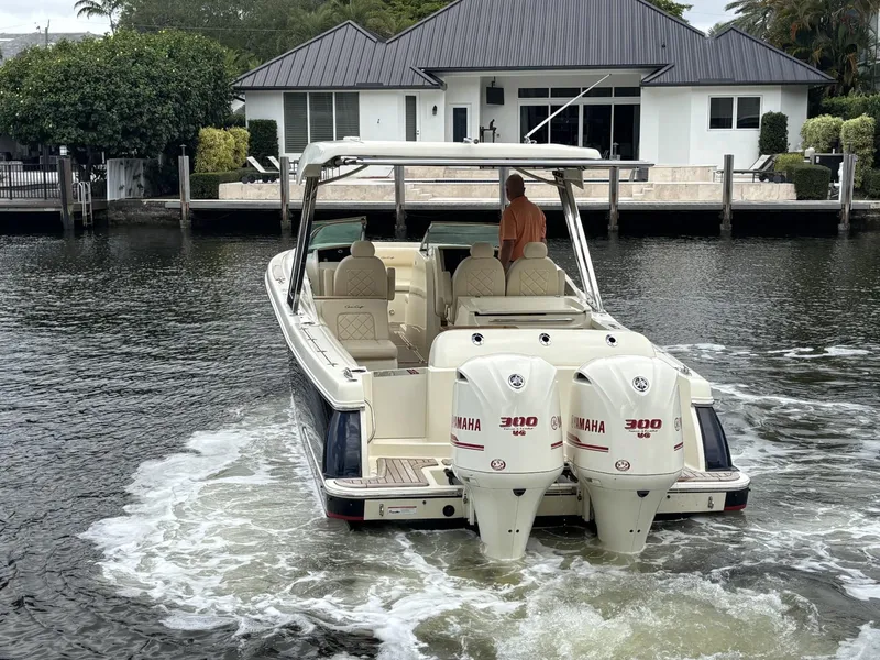Slide: The Image of 2019 Chris-Craft Calypso 30 boat with twin Yamaha 300 engines on a calm waterway. - 3