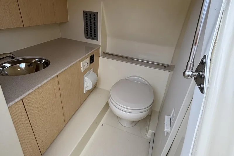 Slide: The Image of 2019 Chris-Craft Calypso 30 boat bathroom with sink and toilet. - 9
