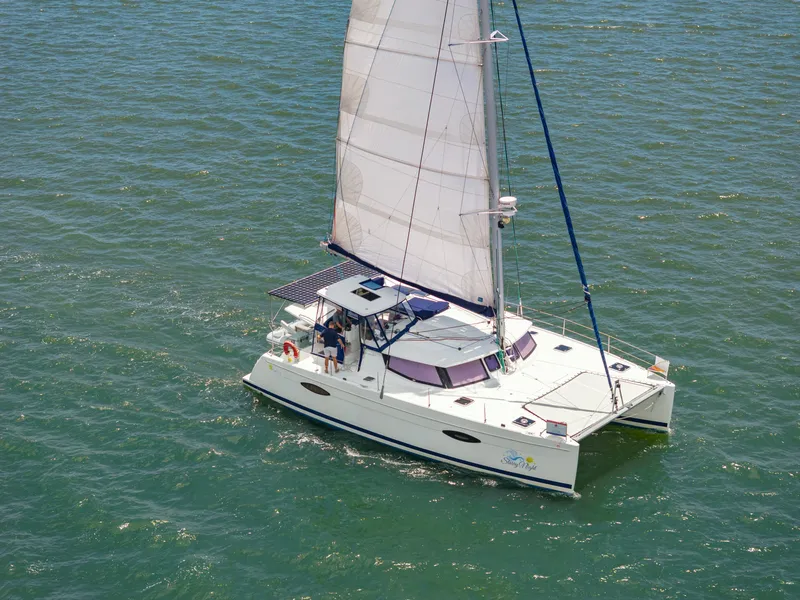 Slide: The Image of 2014 Fountaine Pajot Helia 44 catamaran sailing on open water. - 10