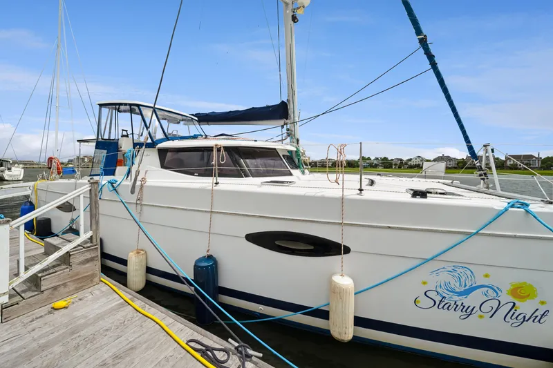 Slide: The Image of 2014 Fountaine Pajot Helia 44 catamaran "Starry Night" docked at marina. - 13