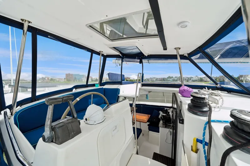 Slide: The Image of 2014 Fountaine Pajot Helia 44 yacht cockpit with steering wheel and seating area. - 22
