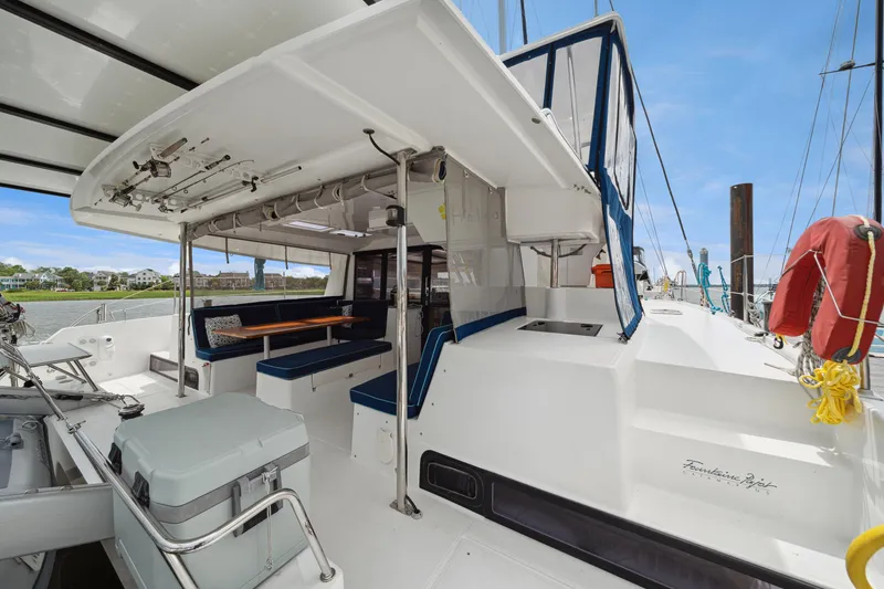 Slide: The Image of 2014 Fountaine Pajot Helia 44 catamaran with spacious deck and seating area. - 33