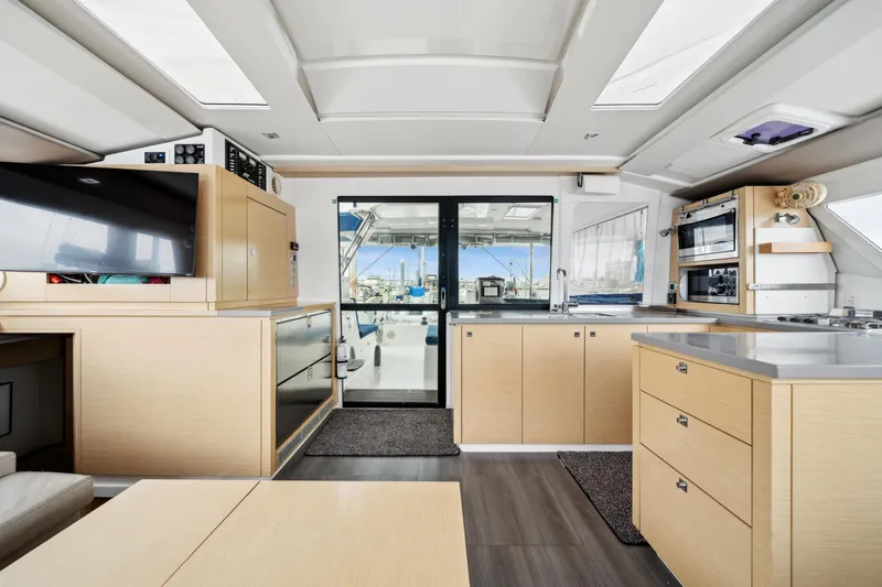 Slide: The Image of Interior of 2014 Fountaine Pajot Helia 44 catamaran, featuring modern kitchen and spacious layout. - 39