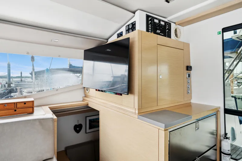 Slide: The Image of Interior of 2014 Fountaine Pajot Helia 44 catamaran with modern cabinetry and large window view. - 40
