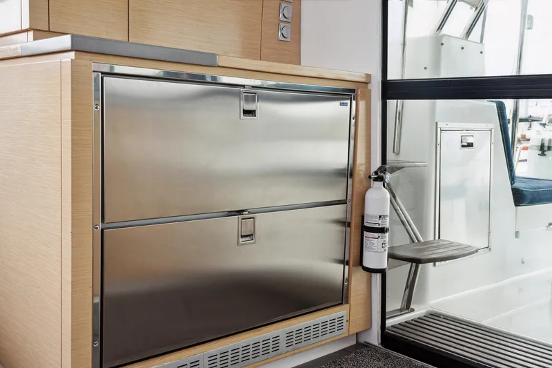Slide: The Image of Interior of 2014 Fountaine Pajot Helia 44 yacht with stainless steel drawers and fire extinguisher. - 43