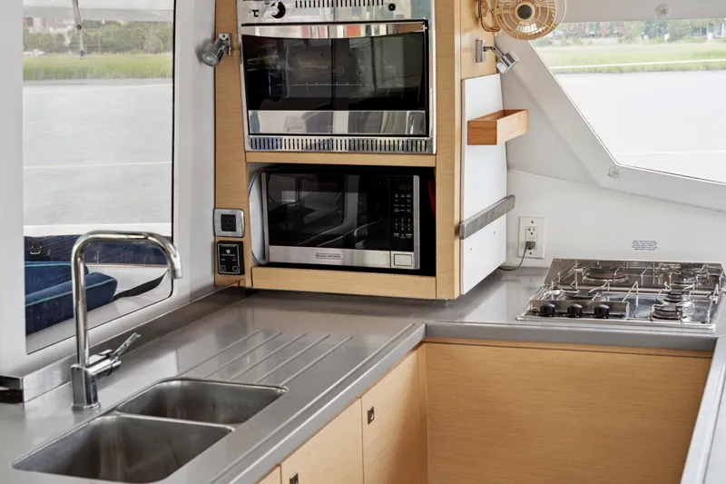 Slide: The Image of Modern kitchen in 2014 Fountaine Pajot Helia 44 catamaran with stainless steel appliances. - 48