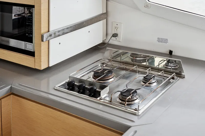 Slide: The Image of Modern kitchen in 2014 Fountaine Pajot Helia 44 yacht with stove and microwave. - 49