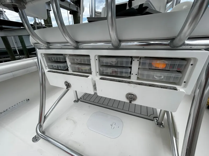 Slide: The Image of 2018 Regulator 23 Forward Seating boat with organized storage compartments and stainless steel fixtures. - 16