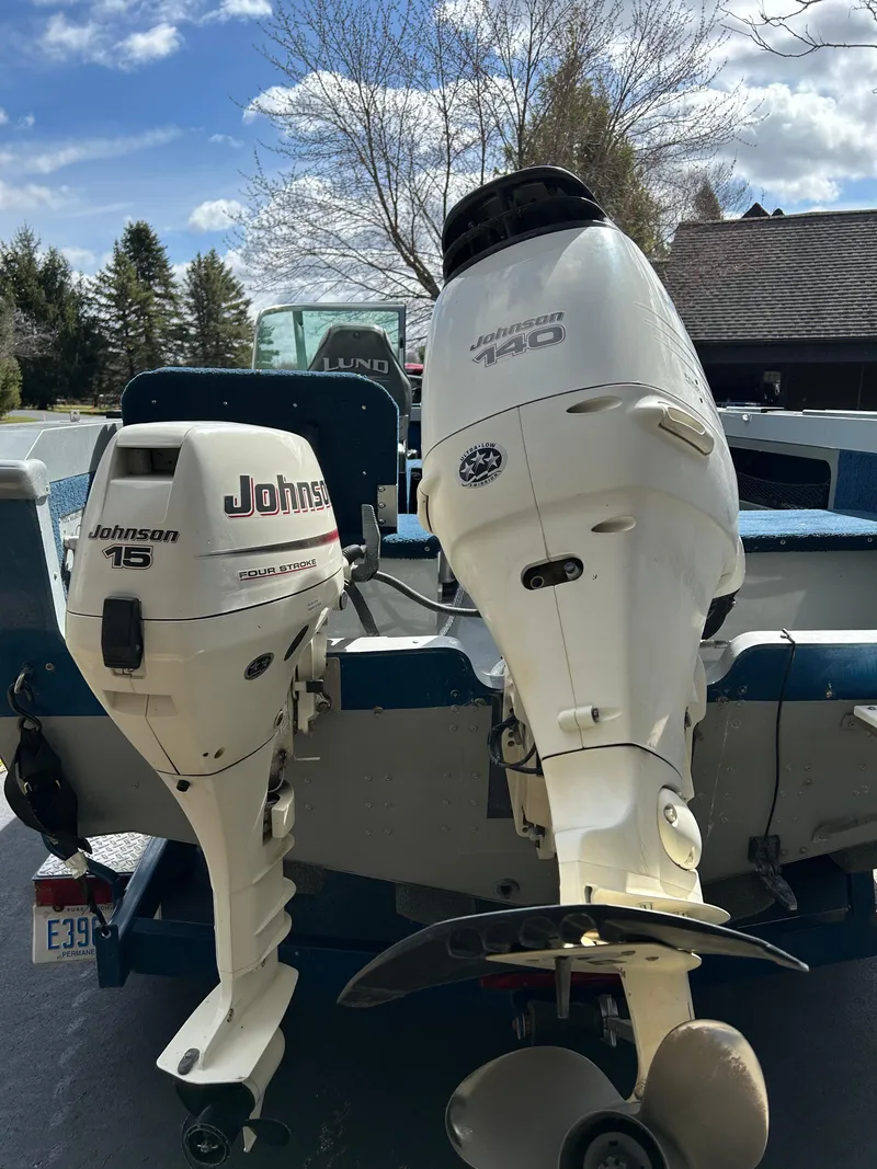 Slide: The Image of 2003 Lund 1800 Fisherman boat with Johnson 15 and 140 outboard motors. - 3