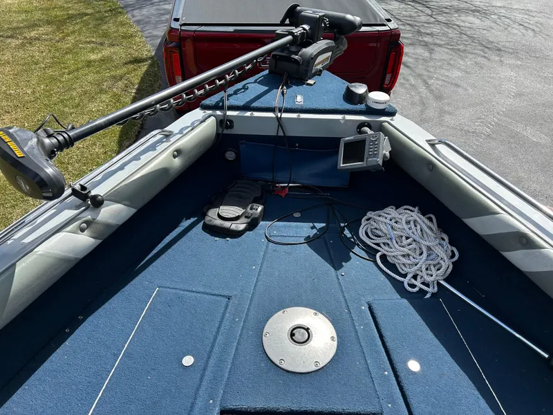 Slide: The Image of 2003 Lund 1800 Fisherman boat interior with trolling motor and navigation equipment. - 4