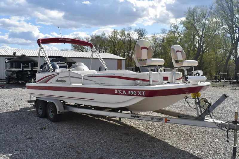 Slide: The Image of 2006 Hurricane FunDeck 228 RE boat on trailer, parked outdoors. - 1
