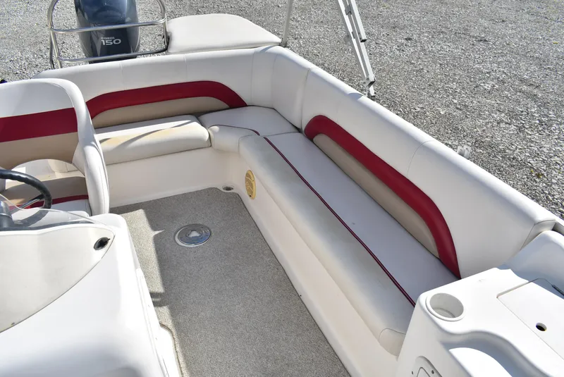 Slide: The Image of 2006 Hurricane FunDeck 228 RE boat interior with white and red seating. - 11