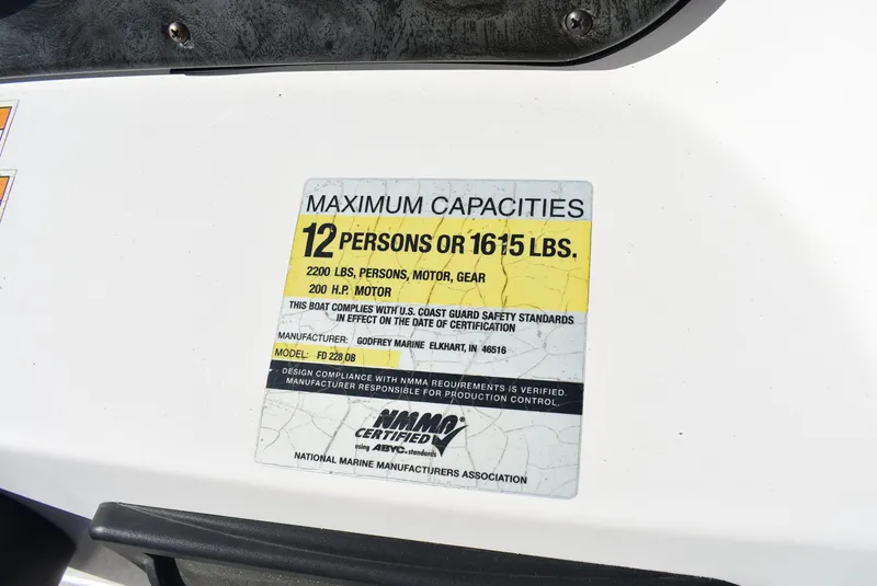 Slide: The Image of 2006 Hurricane FunDeck 228 RE capacity label: 12 persons or 1615 lbs, 2200 lbs total. - 15