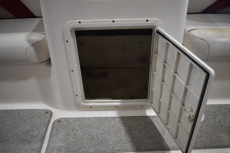 Slide: The Image of Open storage compartment on 2006 Hurricane FunDeck 228 RE boat interior. - 16