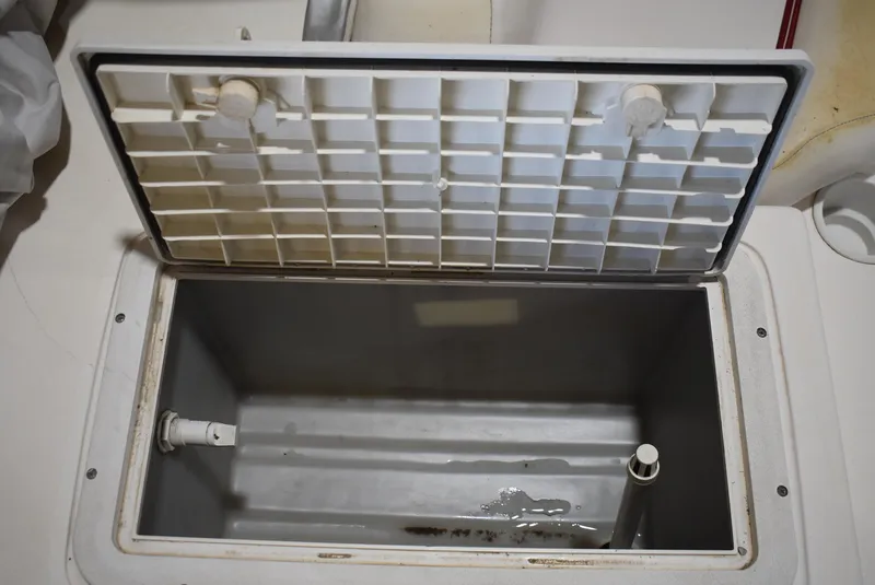 Slide: The Image of Open storage compartment on 2006 Hurricane FunDeck 228 RE boat. - 18