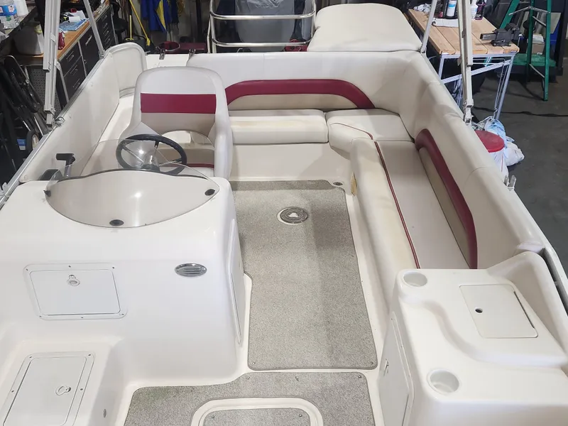 Slide: The Image of 2006 Hurricane FunDeck 228 RE boat interior with seating and steering console. - 8