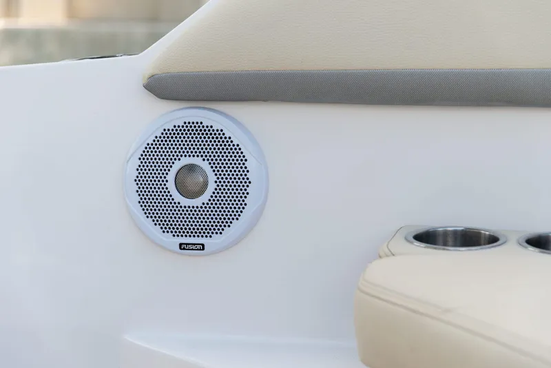 Slide: The Image of Speaker and cup holders on 2022 Regal 26 XO boat interior. - 16