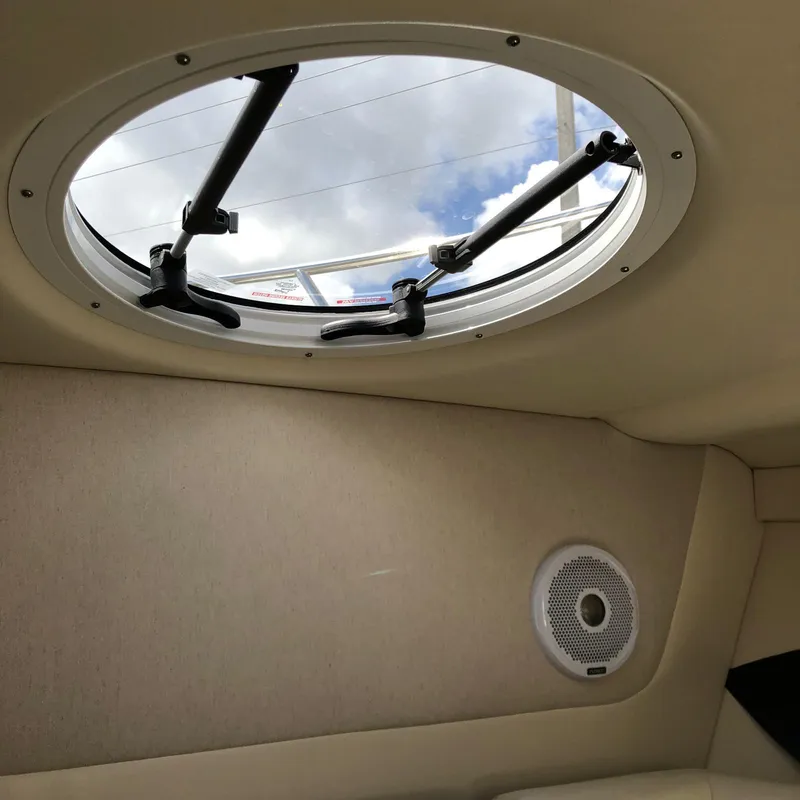 Slide: The Image of 2022 Regal 26 XO boat interior with round hatch and speaker. - 26