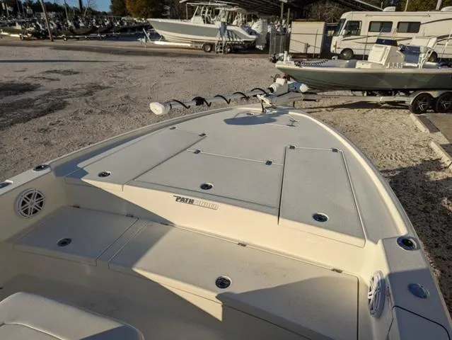 Slide: The Image of 2025 Pathfinder 2500 Hybrid boat on trailer in marina setting. - 11