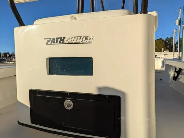 Slide: The Image of 2025 Pathfinder 2500 Hybrid boat console with logo and storage compartment. - 16